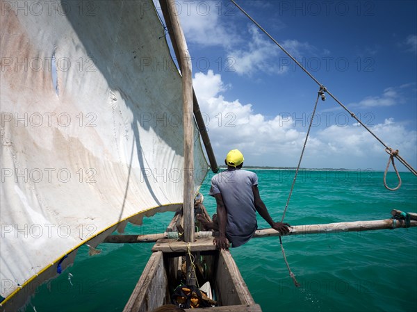 Local on outrigger boat