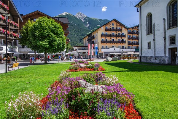 Flower border on the village square with hotels