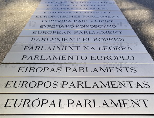 Nameplates of the European Parliament written in different European languages in the Leopold Quarter