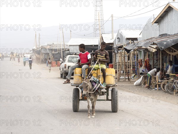 Donkey cart on dusty road