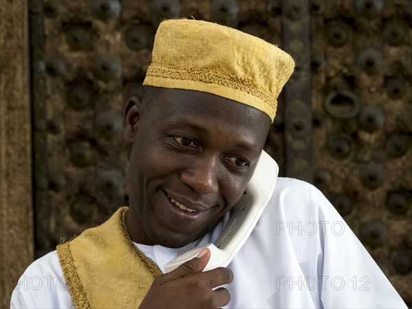 Arab man with traditional headgear on the phone