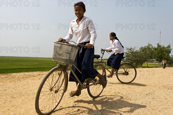 Schoolgirl on bicycle