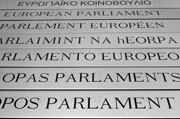 Nameplates of the European Parliament written in different European languages in the Leopold Quarter