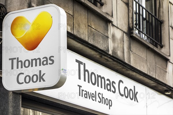 Signboard with logo of Thomas Cook travel shop