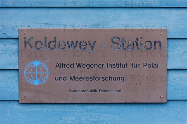 Sign with logo of the Koldewey Station for Arctic and marine research at Ny-Alesund on Svalbard