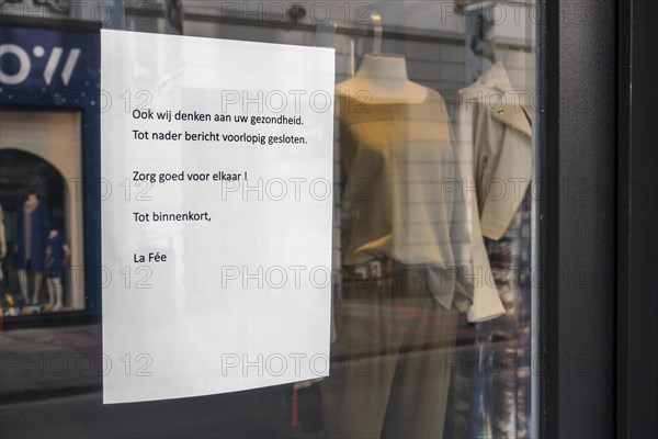Clothes shop's closing notice in shopping street due to the 2020 COVID-19