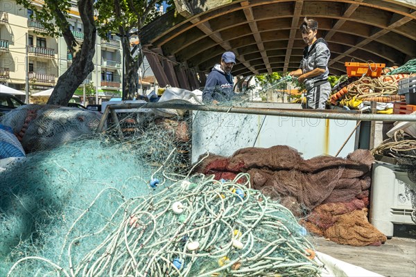 Fisherman with net at work
