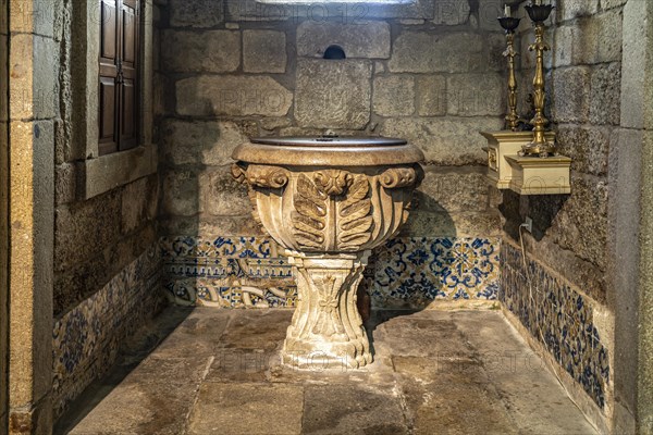 Baptismal font in the church Igreja de Nossa Senhora da Oliveira