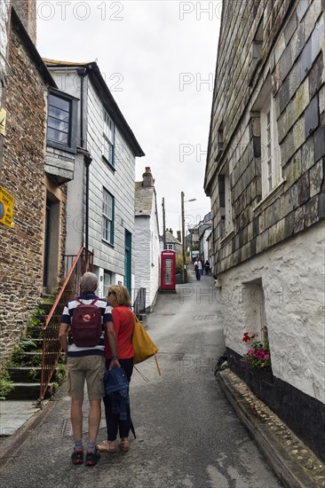 Pedestrians in a narrow alley