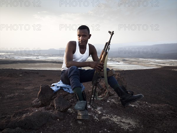 Man with rifle secures terrain