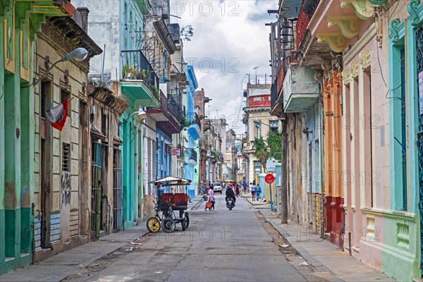 Colourful buildings and bicitaxi