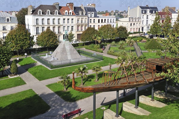 Replica of Egyptian wooden boat and statue of Auguste Mariette in city park at Boulogne-sur-Mer