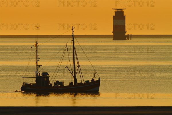 Crab cutter at sunrise in the Weser fairway off Minsener Oog