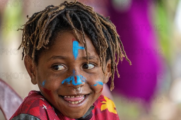 Child in the highlands at a Sing-Sing of the Melpa tribe