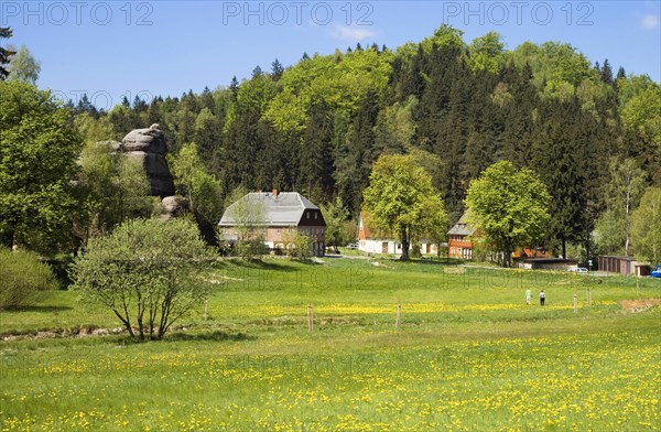 Village in mountain landscape with rocks