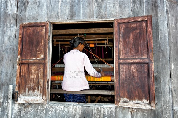 Weaver in weaving mill