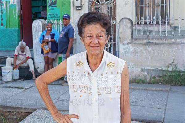 Elderly Cuban lady posing on the street in Bayamo