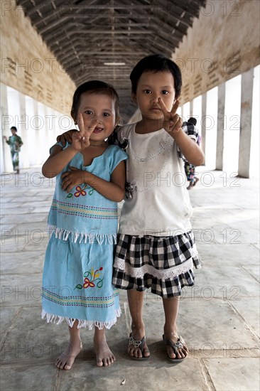 Two girls making Victory sign