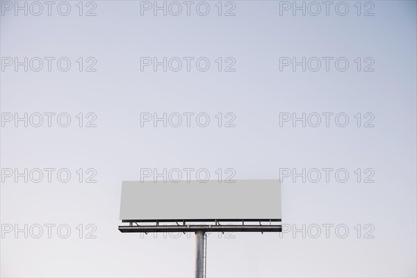 White blank billboard against blue sky