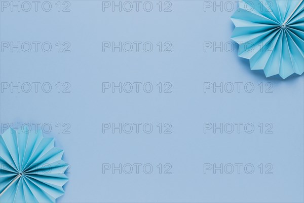 Blue origami paper fan corner blue backdrop
