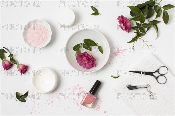 Flat lay spa concept with nail polish rose