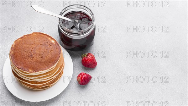 High angle delicious pancakes with jam