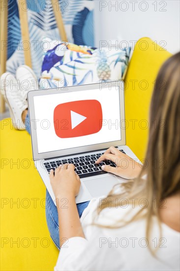 Female sitting with opened laptop