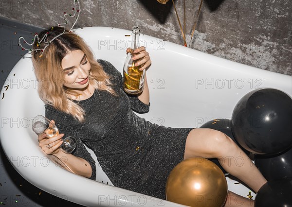 Young woman drunk bathtub home