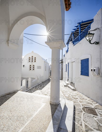 Chapel of Agios Antonios and archway with sun star of the Greek Orthodox church of Metamorfosi Sotiros