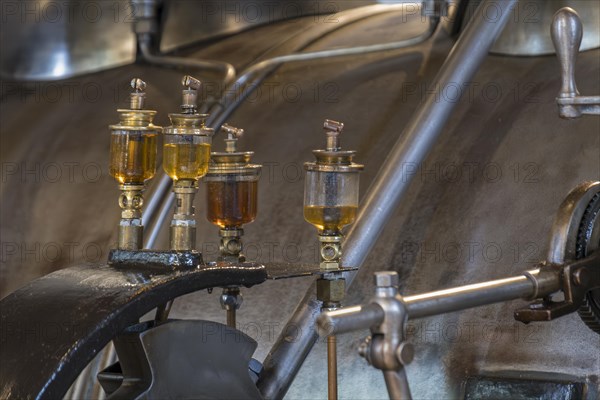 Glass cylinder on historical steam engine