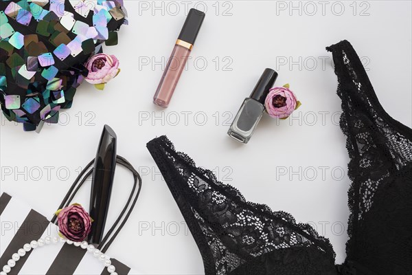 View arrangement with make up items black bra