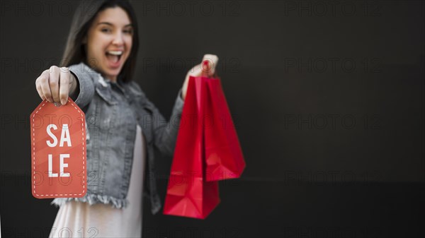 Crying woman with shopping packets sale tablet