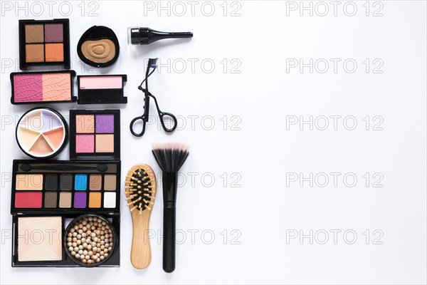 Eye shadows with powder brush comb table