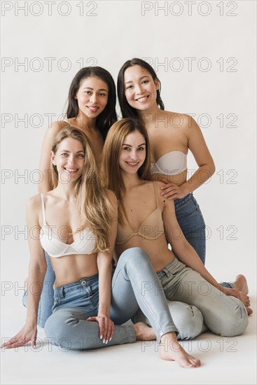 Multiracial group happy women bras jeans