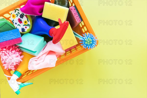 Top view frame with basket with cleaning products