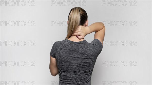 Back view woman with back pain