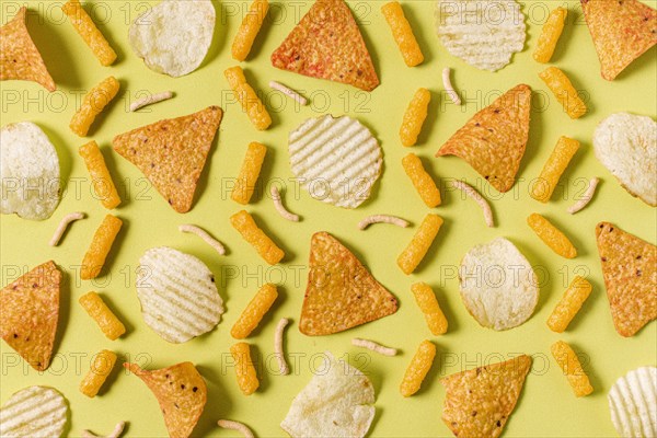 Top view nacho chips with potato chips cheesy puffs