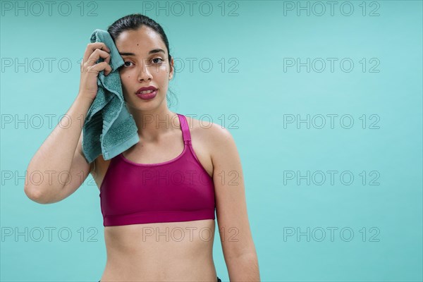 Young woman sweating after training