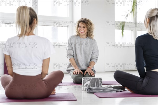 Close up women yoga class