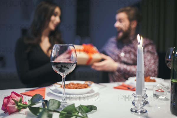 Couple dinner exchanging with presents