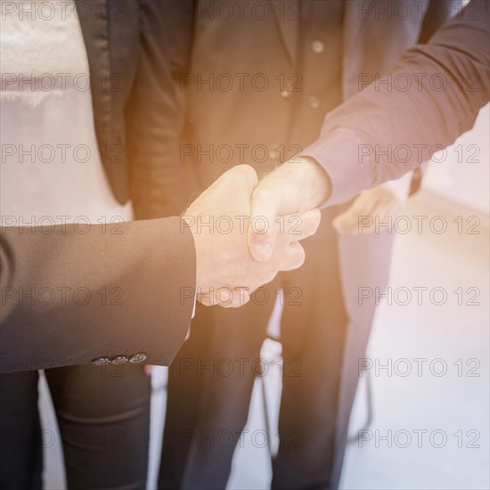 Overhead view two businessman shaking hands together