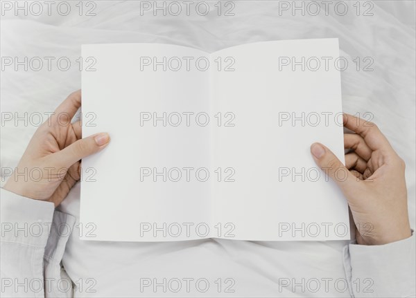 Woman reading book alone