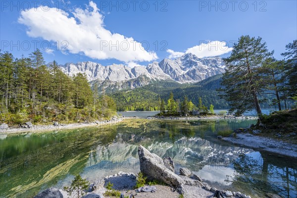 Zugspitze massif and Zugspitze reflected in Eibsee lake