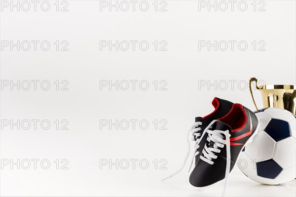 Football composition with shoes ball copyspace