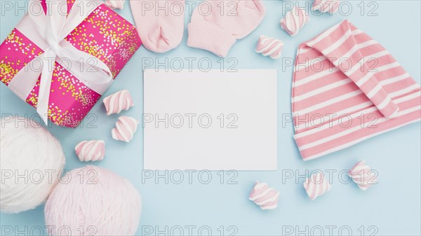 Arrangement baby clothes postcard
