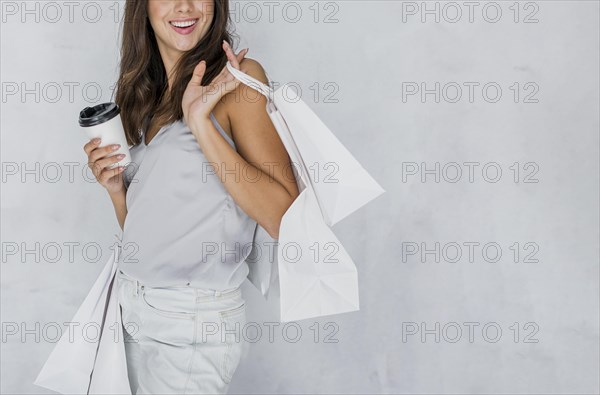 Happy woman undershirt with shopping nets coffee