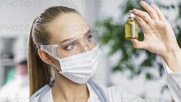 Front view female researcher with medical mask vaccine