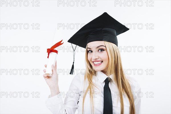 Laughing woman showing graduate certificate