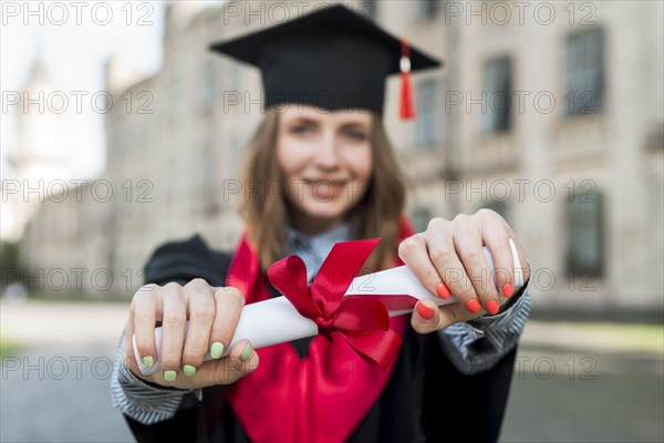Graduation concept with portrait happy woman
