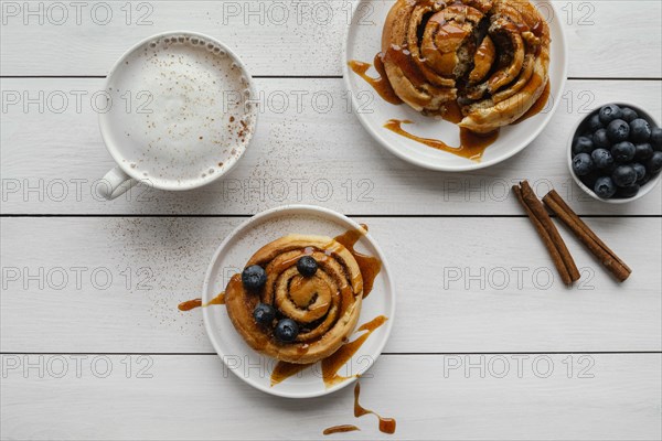 Top view cinnamon rolls wooden table